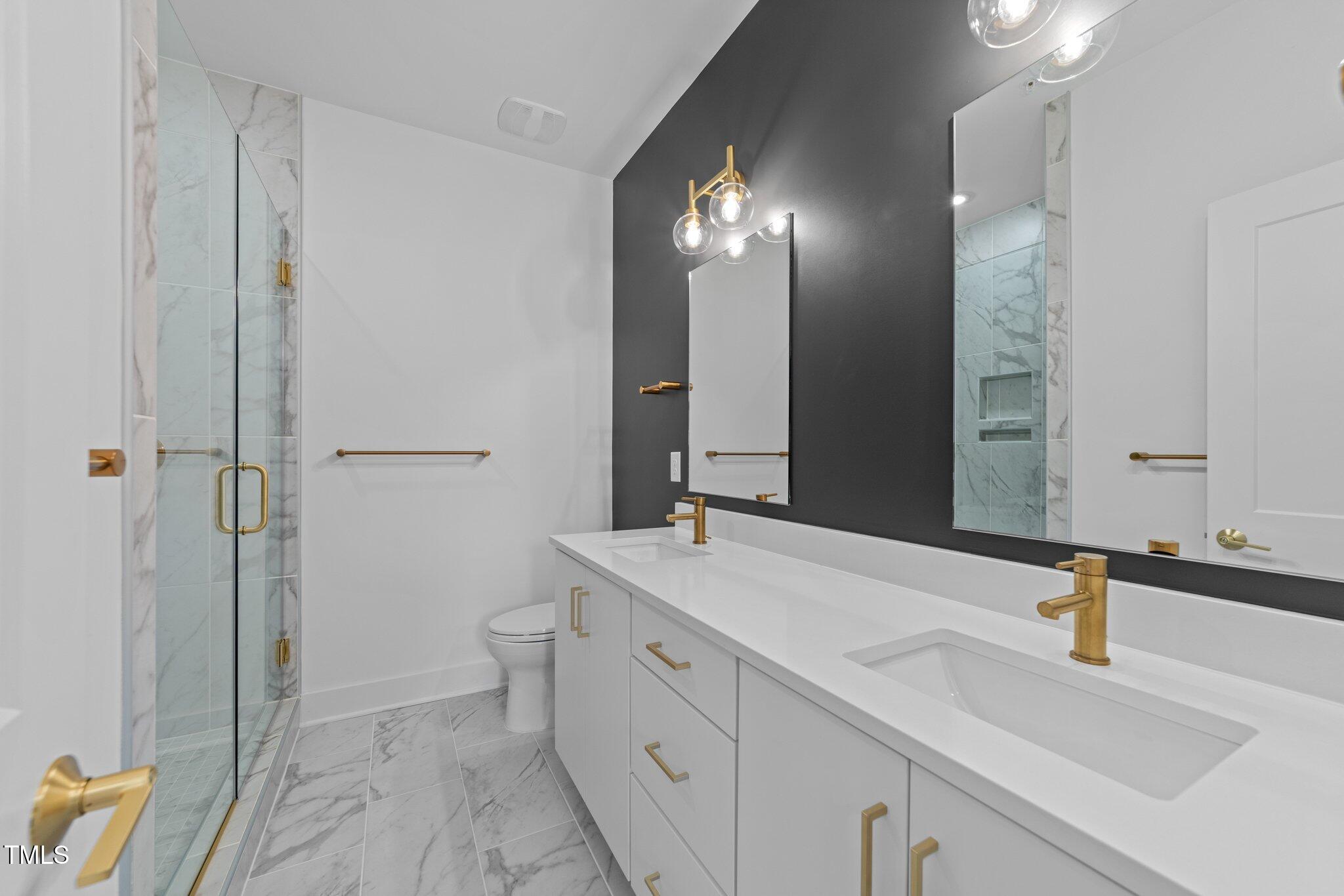 710 West North Street, Unit 102 Raleigh, NC 27603 - Photo 26 of 37 a bathroom with a sink and a mirror