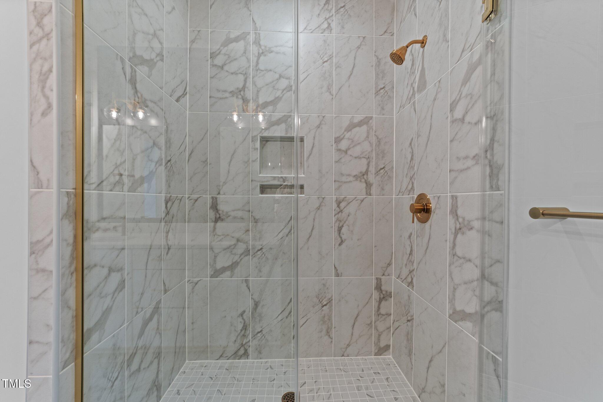 710 West North Street, Unit 102 Raleigh, NC 27603 - Photo 27 of 37 a bathroom with a shower