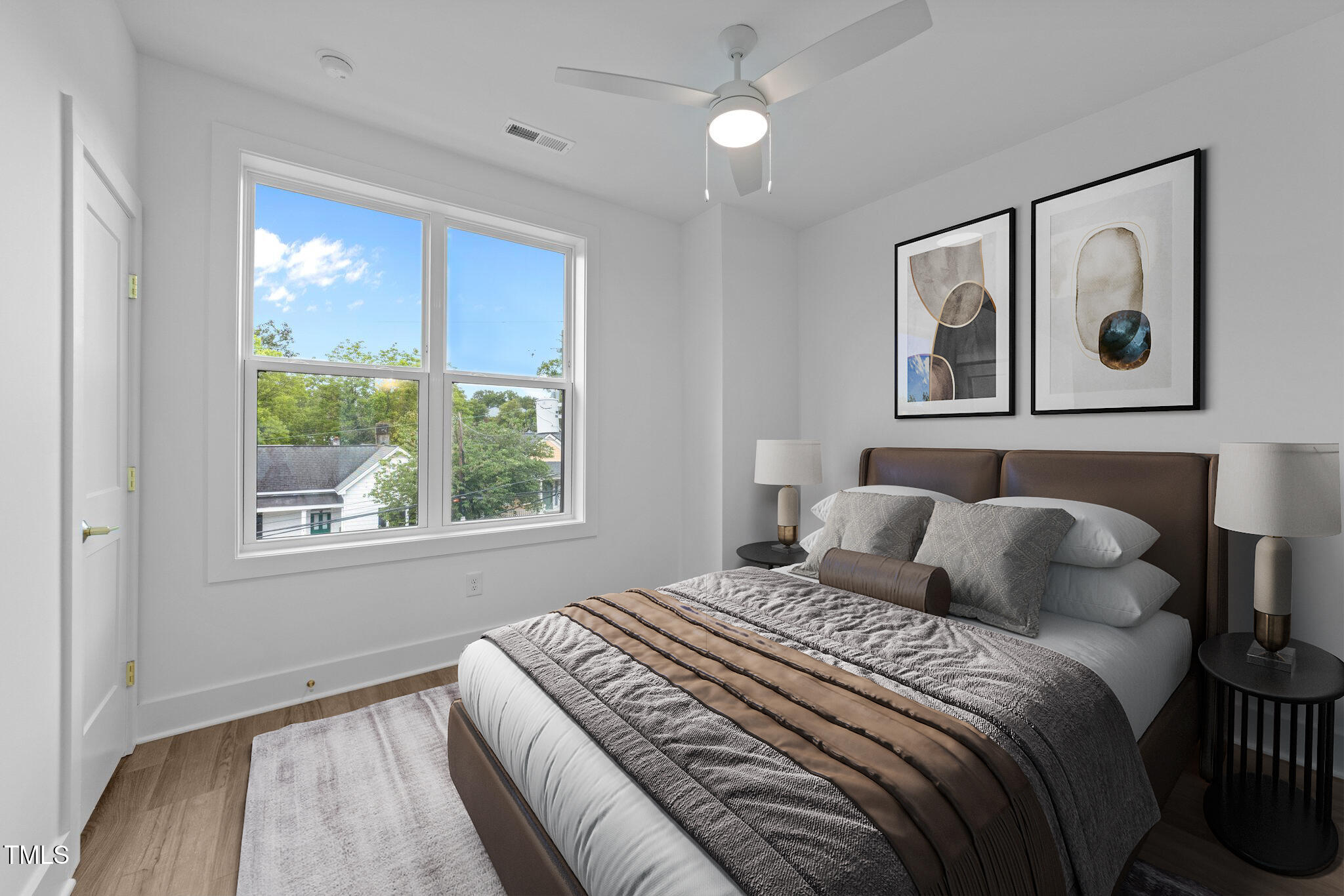710 West North Street, Unit 102 Raleigh, NC 27603 - Photo 28 of 37 a bedroom with a bed and a window