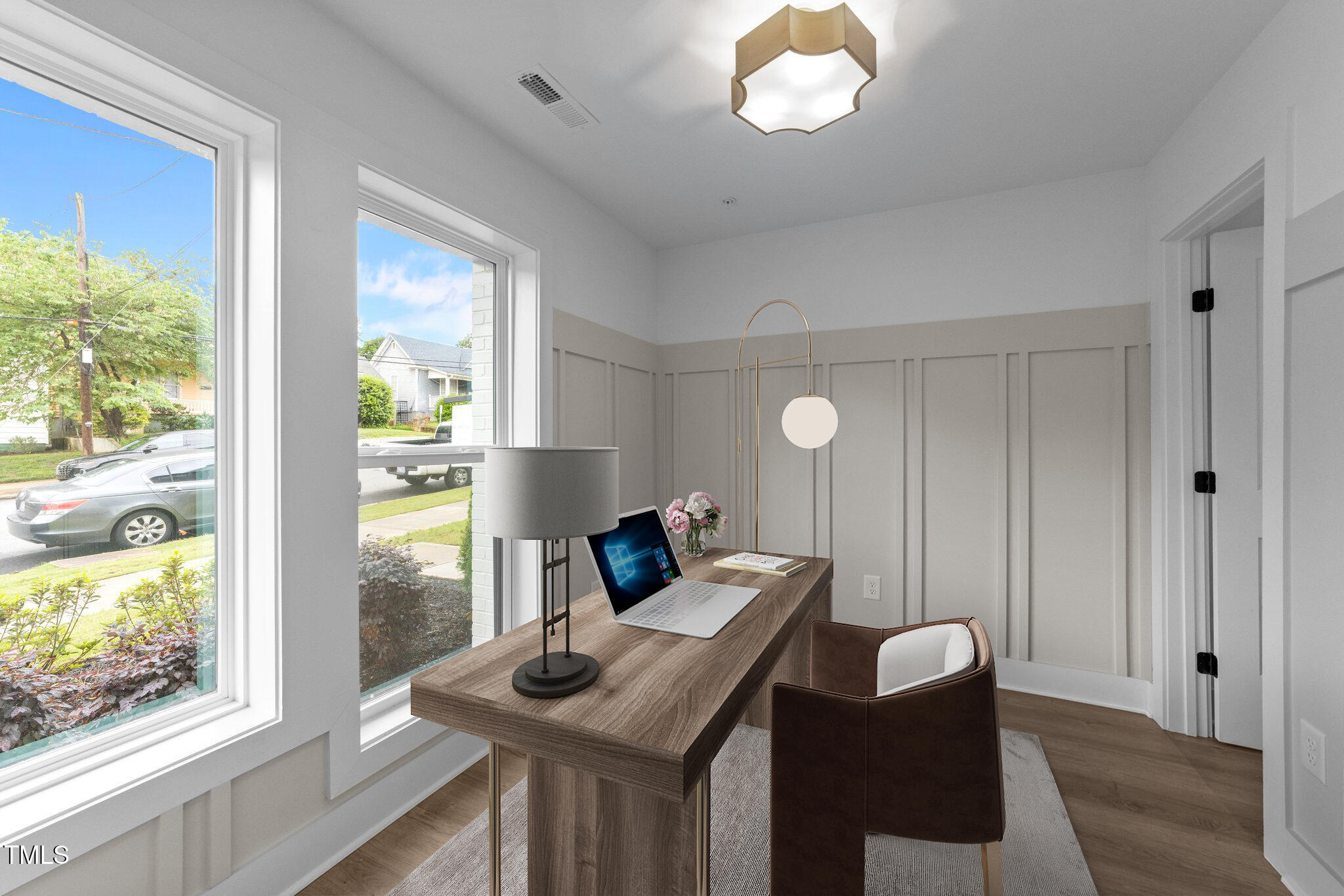 710 West North Street, Unit 102 Raleigh, NC 27603 - Photo 8 of 37 a living room with furniture and a window