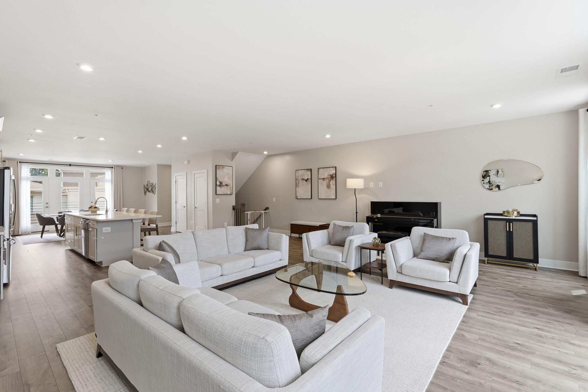 1702 Bandit Loop, Unit 19B Reston, VA 20190 - Photo 6 of 31 Open concept living room, kitchen, and dining room
