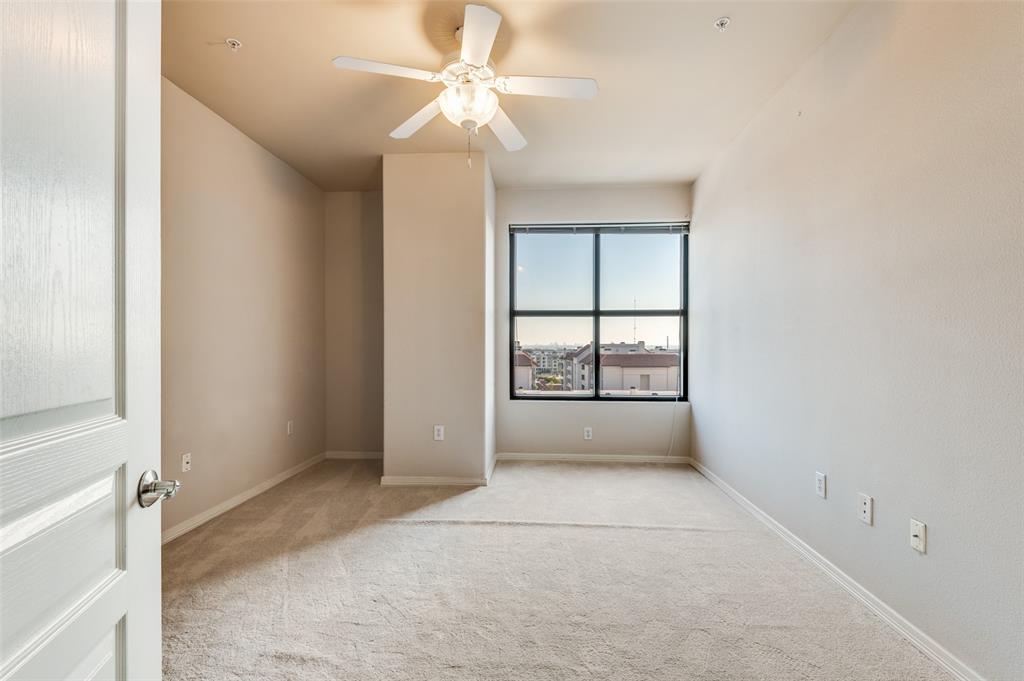 330 Las Colinas Boulevard East, Unit 924 Irving, TX 75039 - Photo 11 of 20 an empty room with chandelier fan and windows