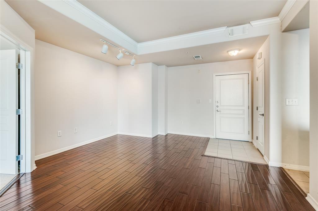 330 Las Colinas Boulevard East, Unit 924 Irving, TX 75039 - Photo 2 of 20 a view of an empty room with wooden floor