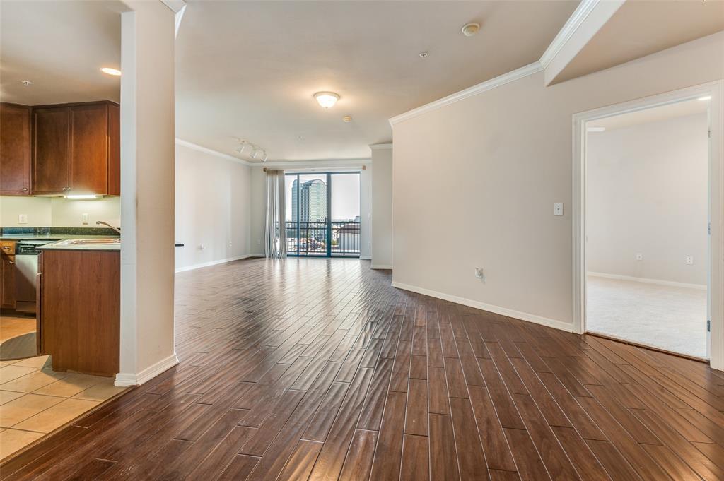 330 Las Colinas Boulevard East, Unit 924 Irving, TX 75039 - Photo 5 of 20 wooden floor in an empty room with a window