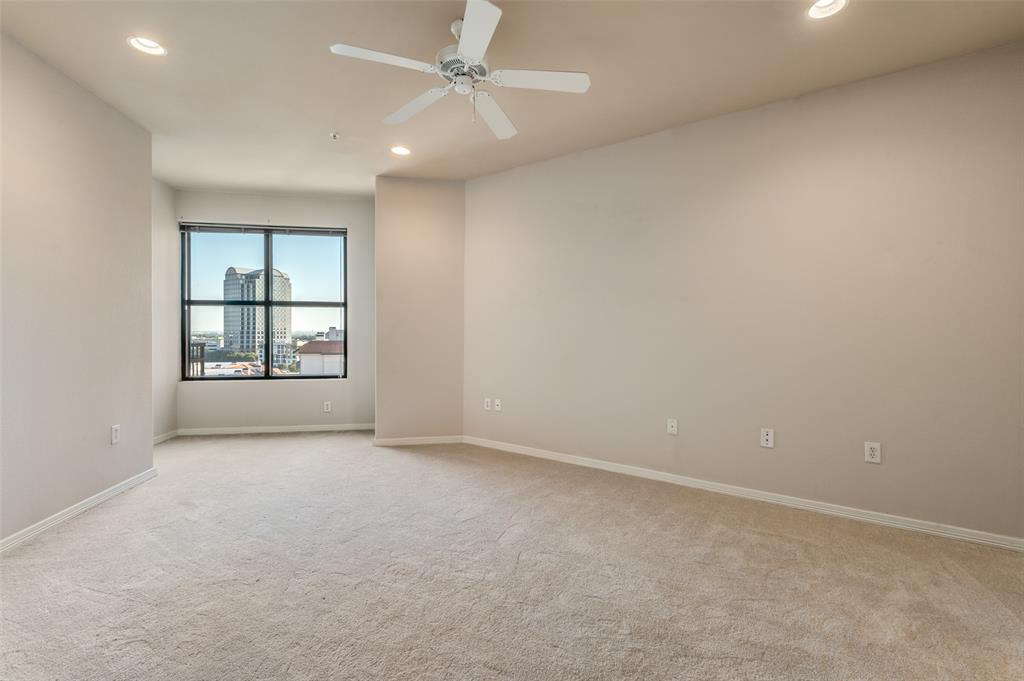 330 Las Colinas Boulevard East, Unit 924 Irving, TX 75039 - Photo 8 of 20 an empty room with windows and ceiling fan