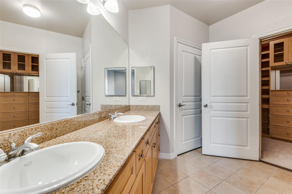 330 Las Colinas Boulevard East, Unit 924 Irving, TX 75039 - Photo 9 of 20 a bathroom with a granite countertop sink and a mirror