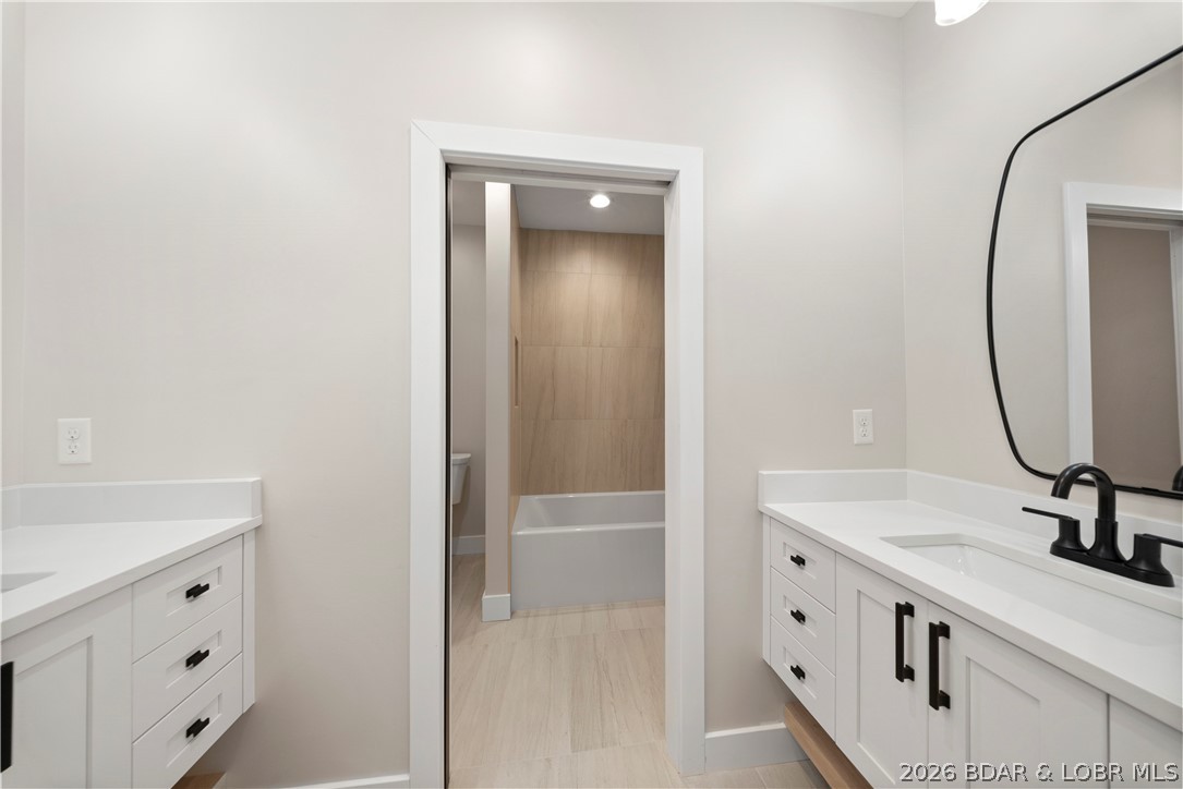 439 Red Bud Road Lake Ozark, MO 65049 - Photo 67 of 98 Another view of the dual-vanity bathroom highlight