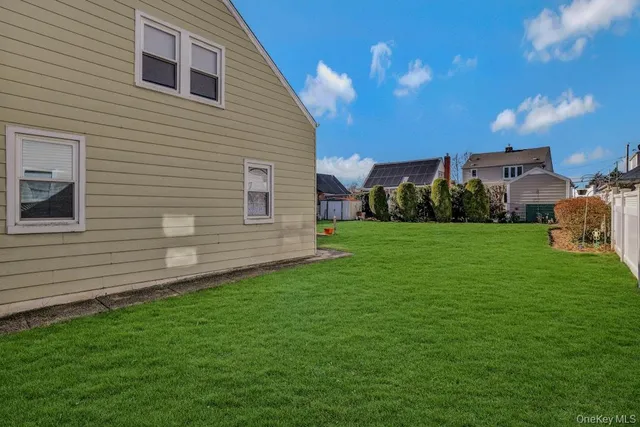 a view of a house with a backyard