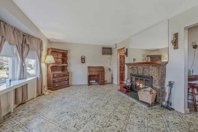 a room with furniture and a fireplace