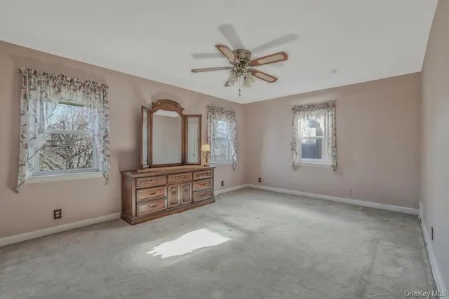 a view of a livingroom with a ceiling fan