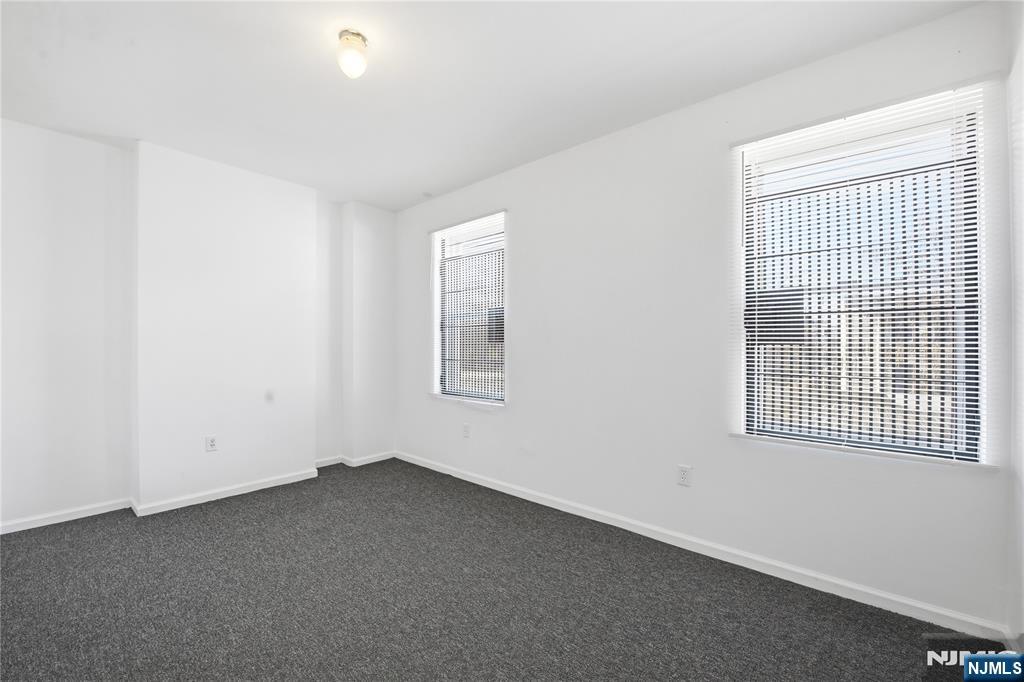 44 1/2 3rd Street, Unit 2 Newark, NJ 07107 - Photo 9 of 15 an empty room with a window