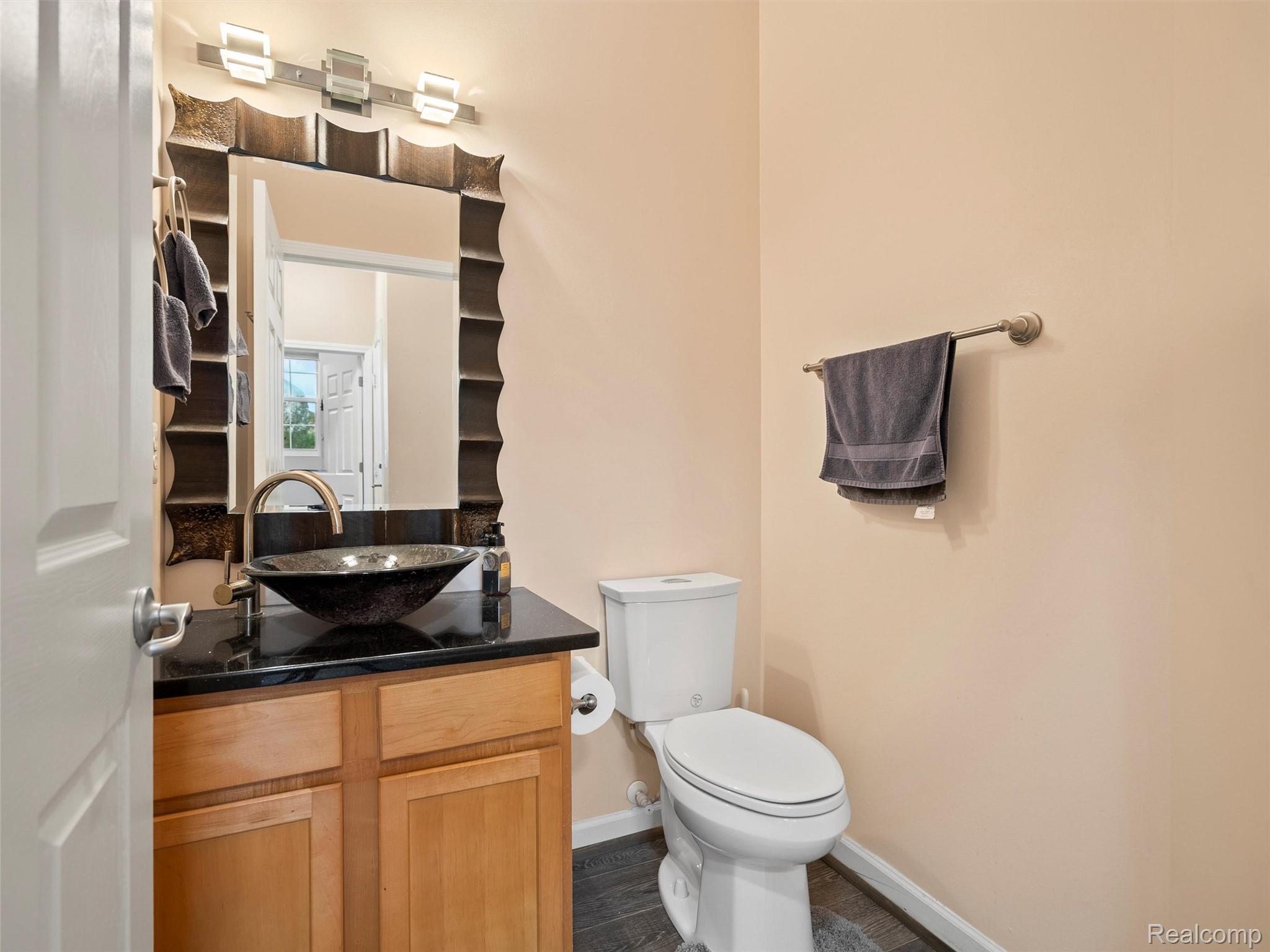 3191 Wren Lane Rochester, MI 48309 - Photo 36 of 63 Bathroom with vanity and dark wood finished floors