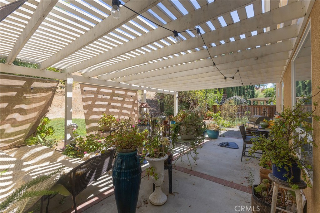 25960 Schafer Drive Murrieta, CA 92563 - Photo 14 of 46 a view of a porch with chairs and potted plants