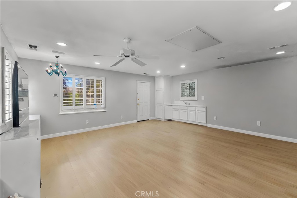 25960 Schafer Drive Murrieta, CA 92563 - Photo 20 of 46 an empty room with windows and chandelier fan