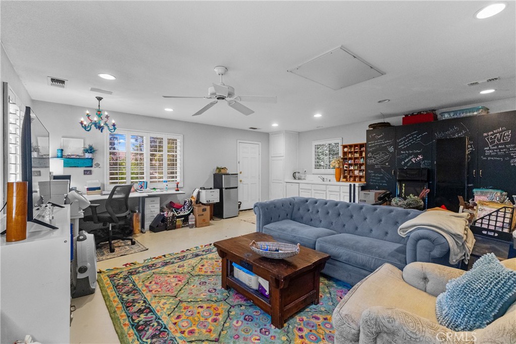 25960 Schafer Drive Murrieta, CA 92563 - Photo 23 of 46 a living room with furniture ceiling fan and a rug