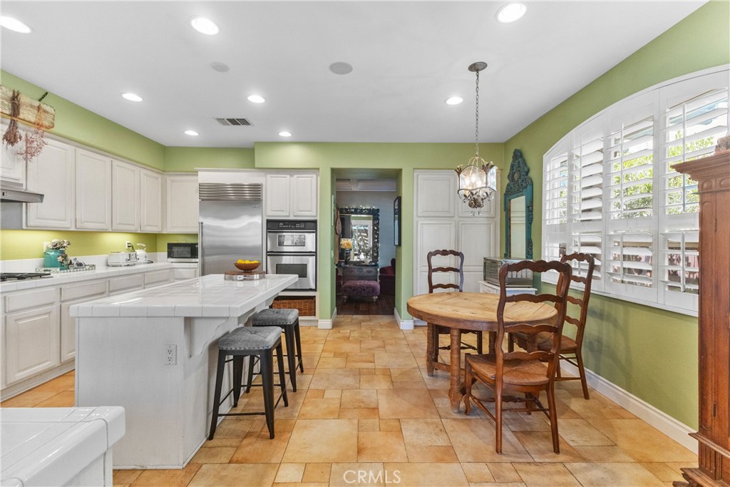 25960 Schafer Drive Murrieta, CA 92563 - Photo 29 of 46 a kitchen with stainless steel appliances kitchen island granite countertop a sink and cabinets