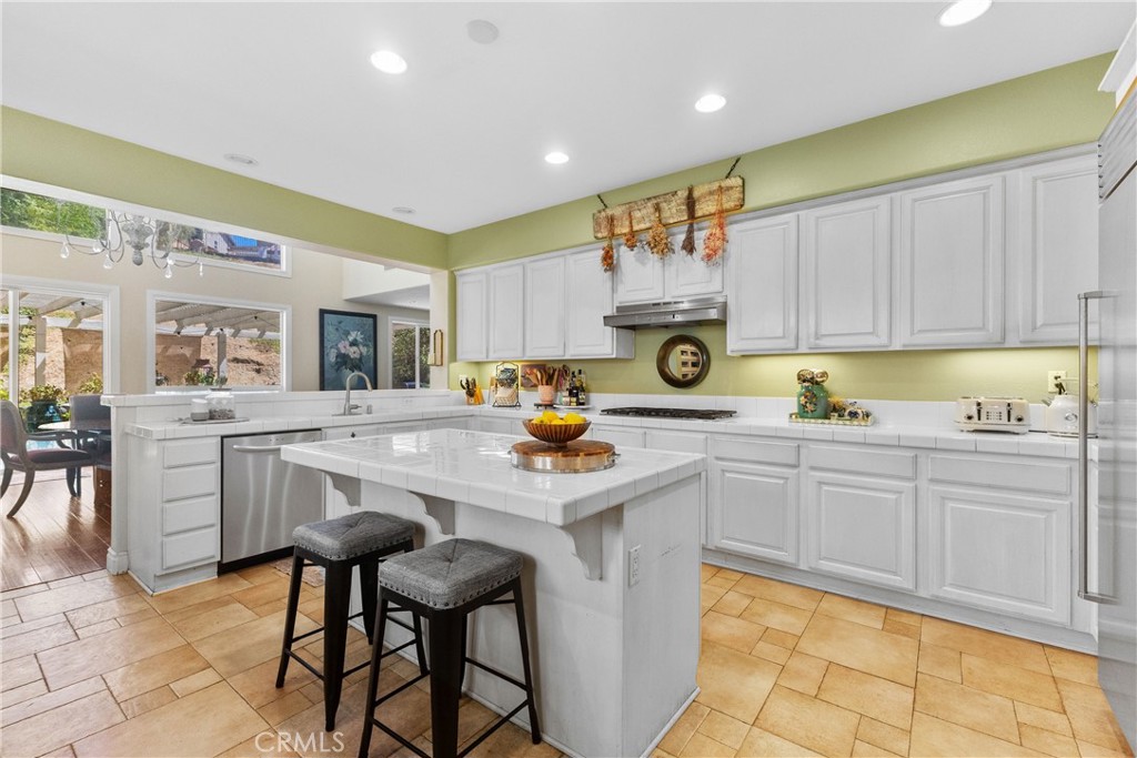 25960 Schafer Drive Murrieta, CA 92563 - Photo 32 of 46 a kitchen with a sink cabinets and window