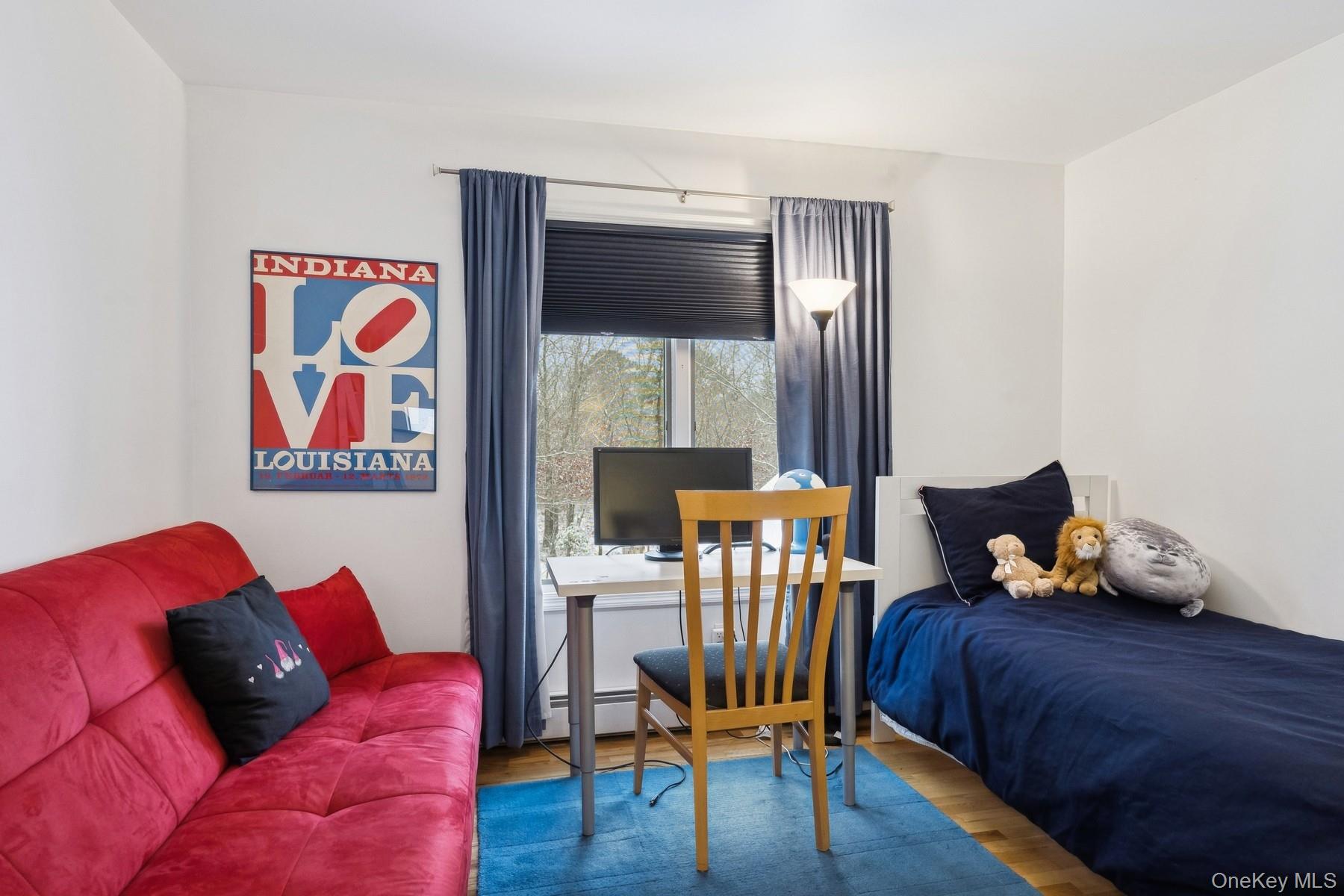 12 Hildreth Road Hampton Bays, NY 11946 - Photo 16 of 21 a living room with furniture and wooden floor