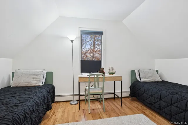 a bedroom with a bed and a chair