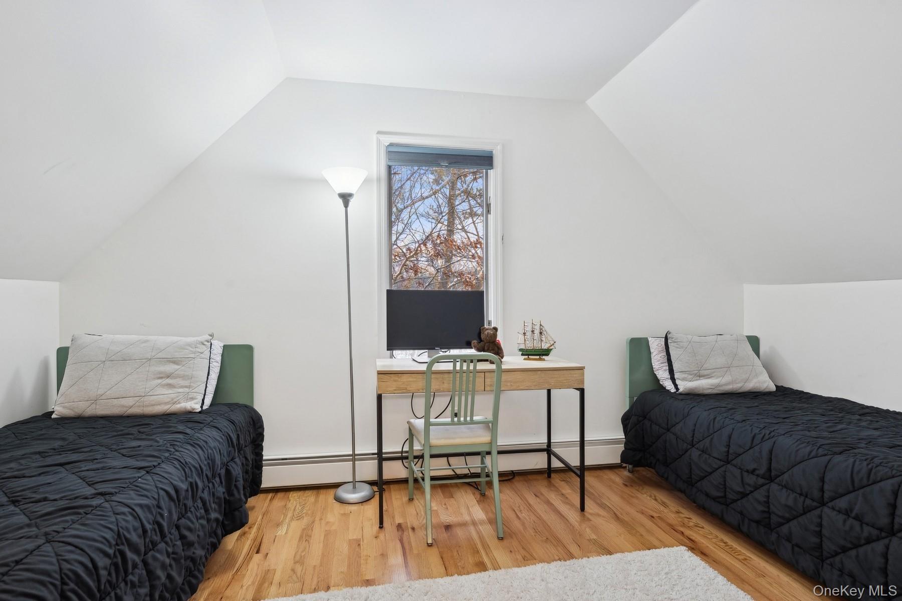 12 Hildreth Road Hampton Bays, NY 11946 - Photo 17 of 21 a bedroom with a bed and a chair