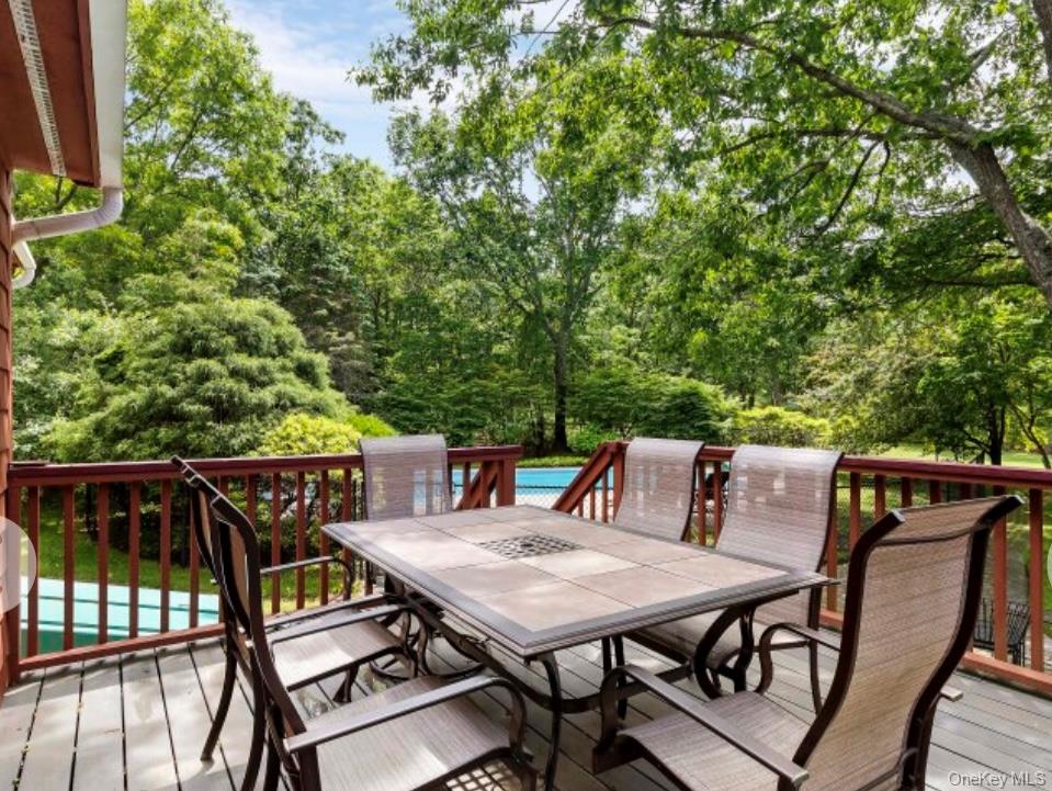 12 Hildreth Road Hampton Bays, NY 11946 - Photo 3 of 21 a view of a dinning table and chairs on the roof deck