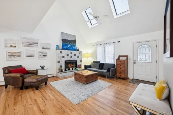 a living room with furniture fireplace and rug