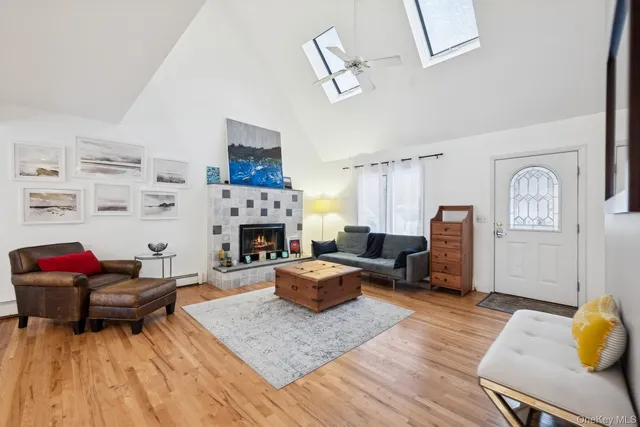 a living room with furniture fireplace and rug