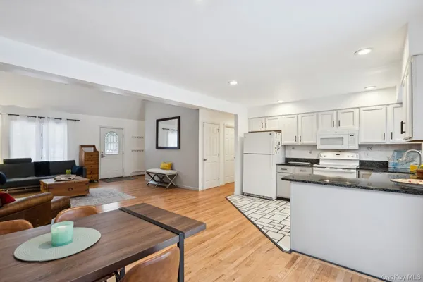 a kitchen with stainless steel appliances granite countertop a sink counter space and cabinets