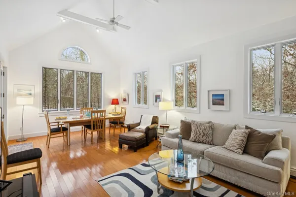 a living room with furniture or couch and a large window