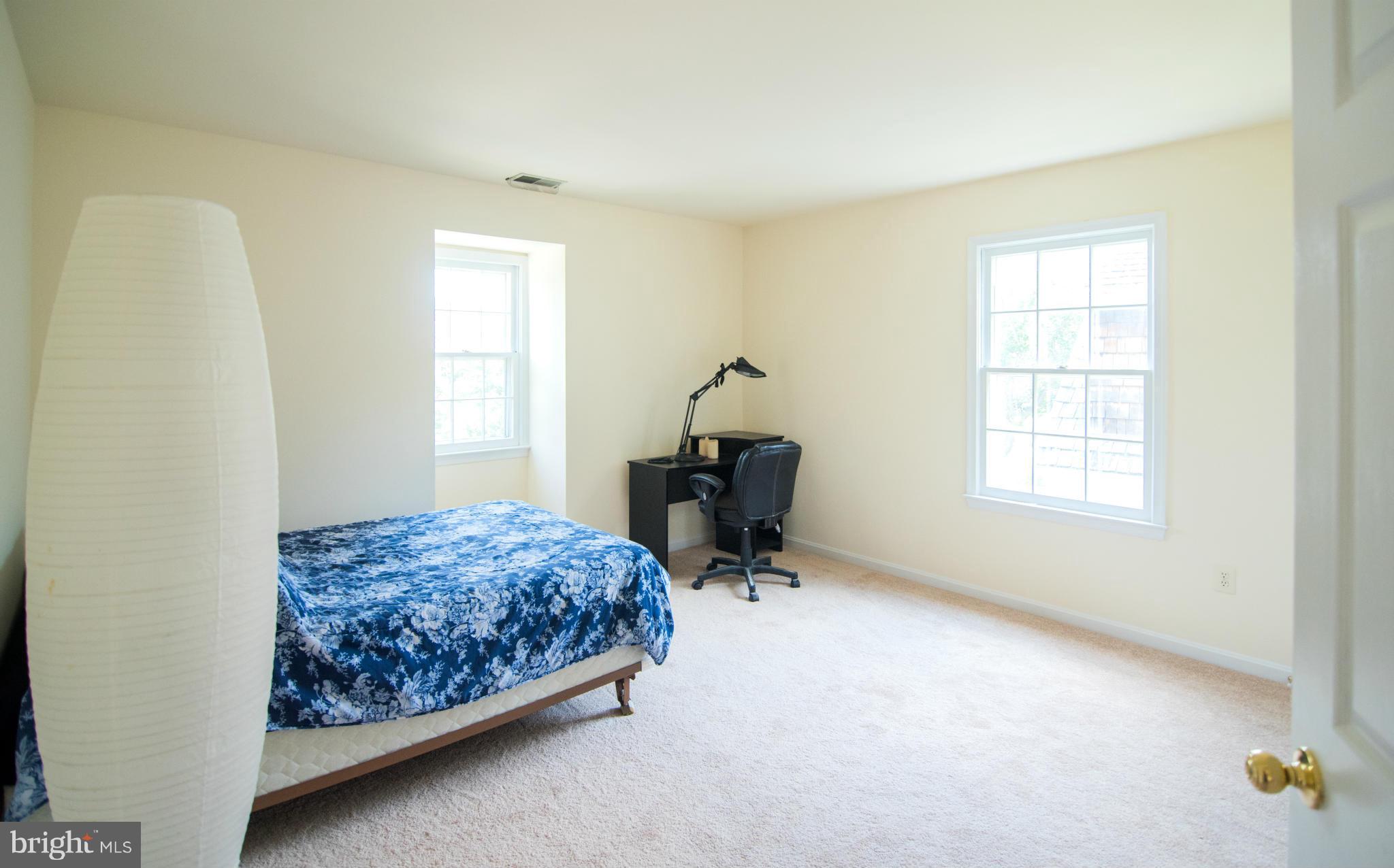 4 Midsummer Court Gaithersburg, MD 20878 - Photo 13 of 24 a bedroom with a bed and a window