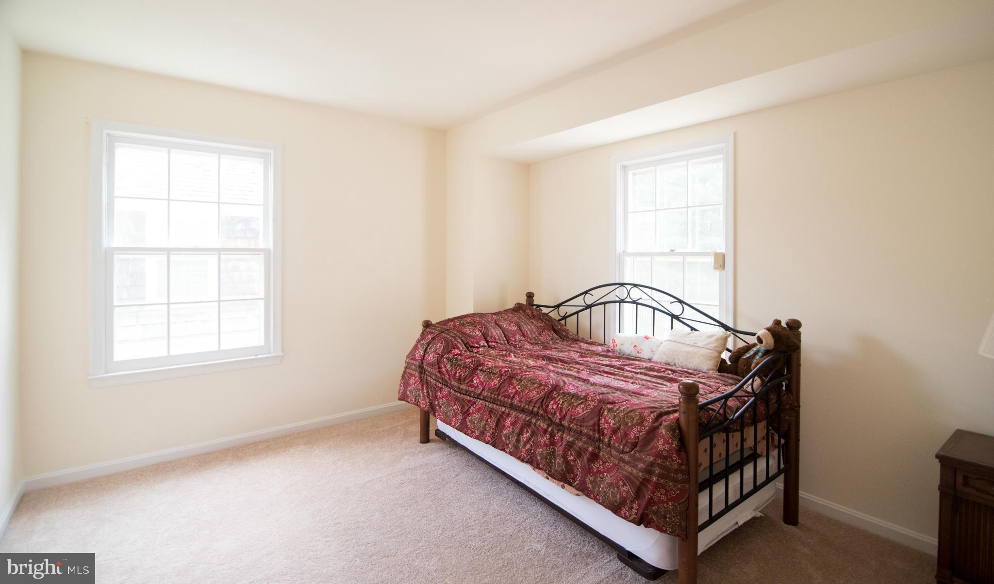 4 Midsummer Court Gaithersburg, MD 20878 - Photo 14 of 24 a bedroom with a bed and window