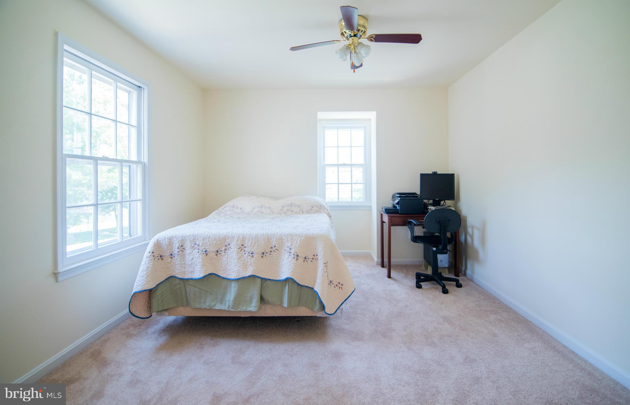 4 Midsummer Court Gaithersburg, MD 20878 - Photo 15 of 24 a bedroom with a bed and a window