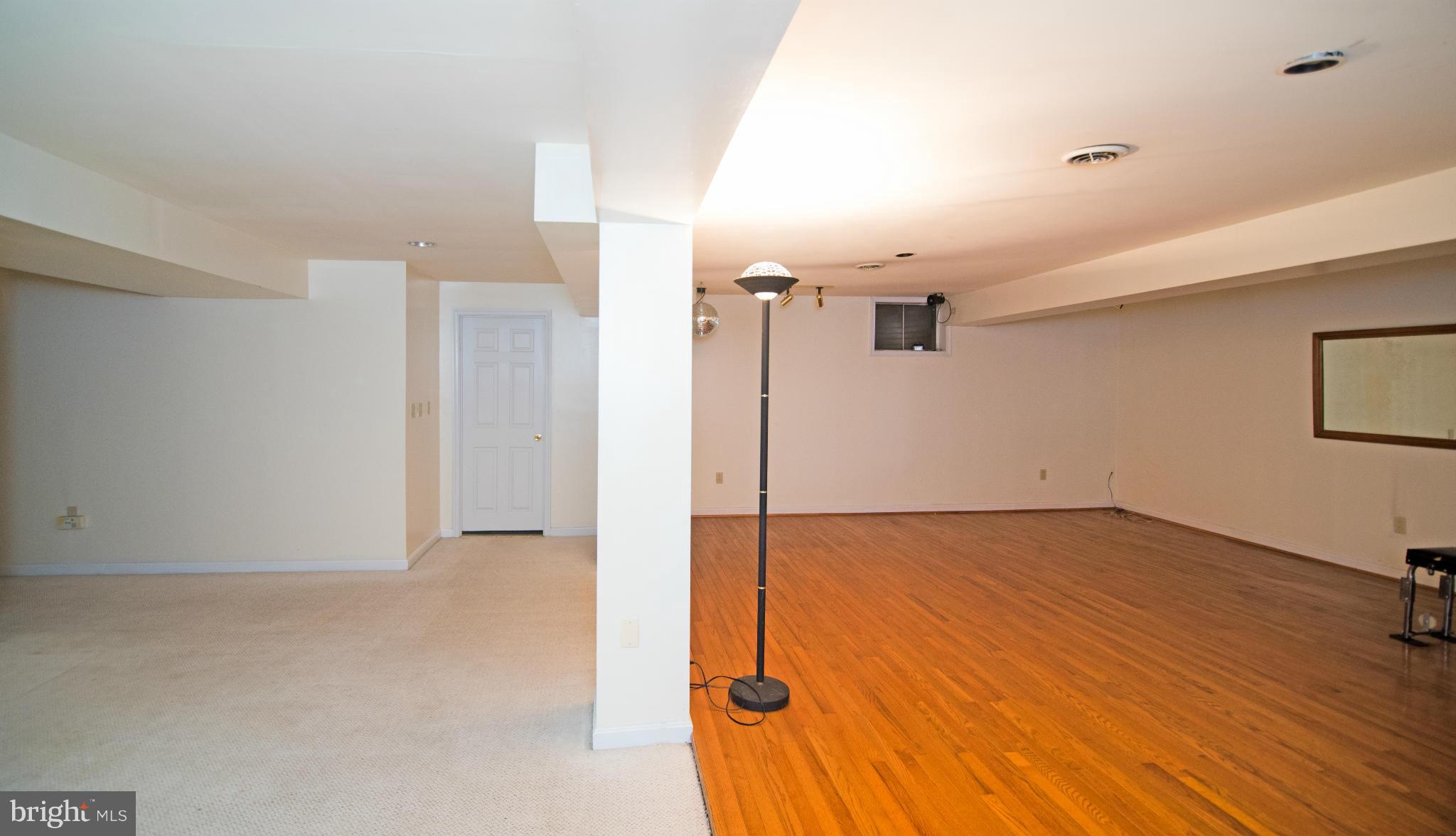 4 Midsummer Court Gaithersburg, MD 20878 - Photo 20 of 24 a view of a livingroom with wooden floor