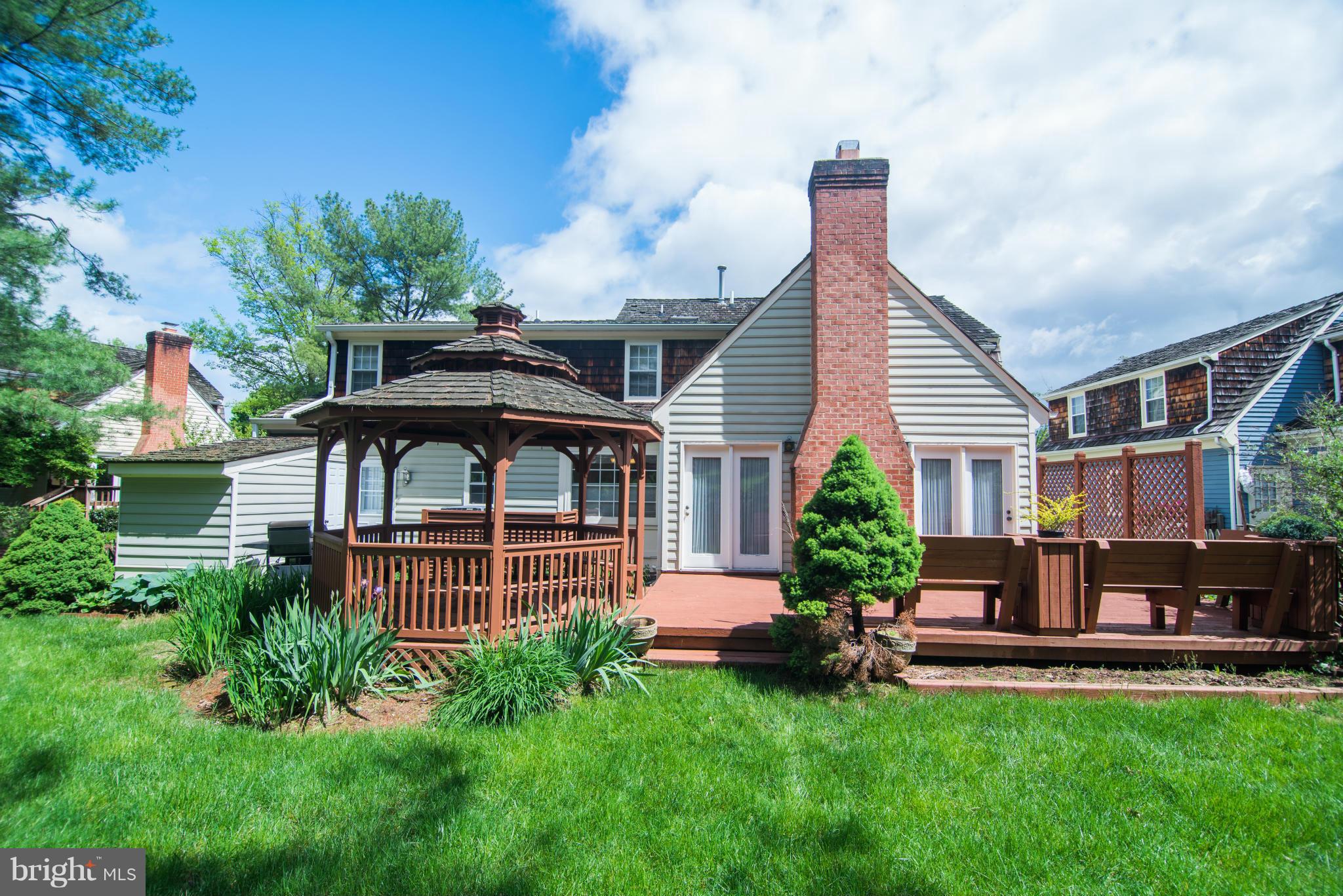 4 Midsummer Court Gaithersburg, MD 20878 - Photo 22 of 24 a view of a house with a backyard