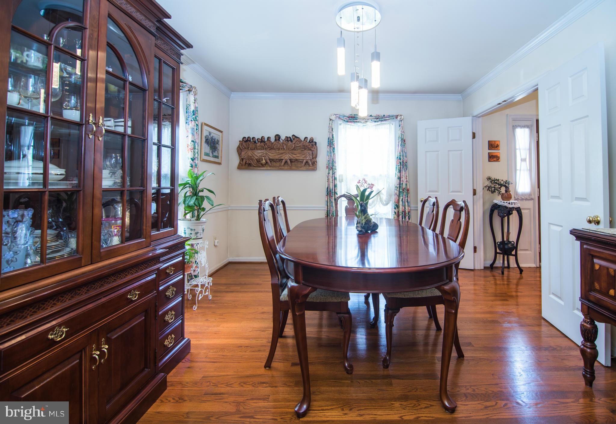 4 Midsummer Court Gaithersburg, MD 20878 - Photo 10 of 24 a view of a dining room with furniture and chandelier