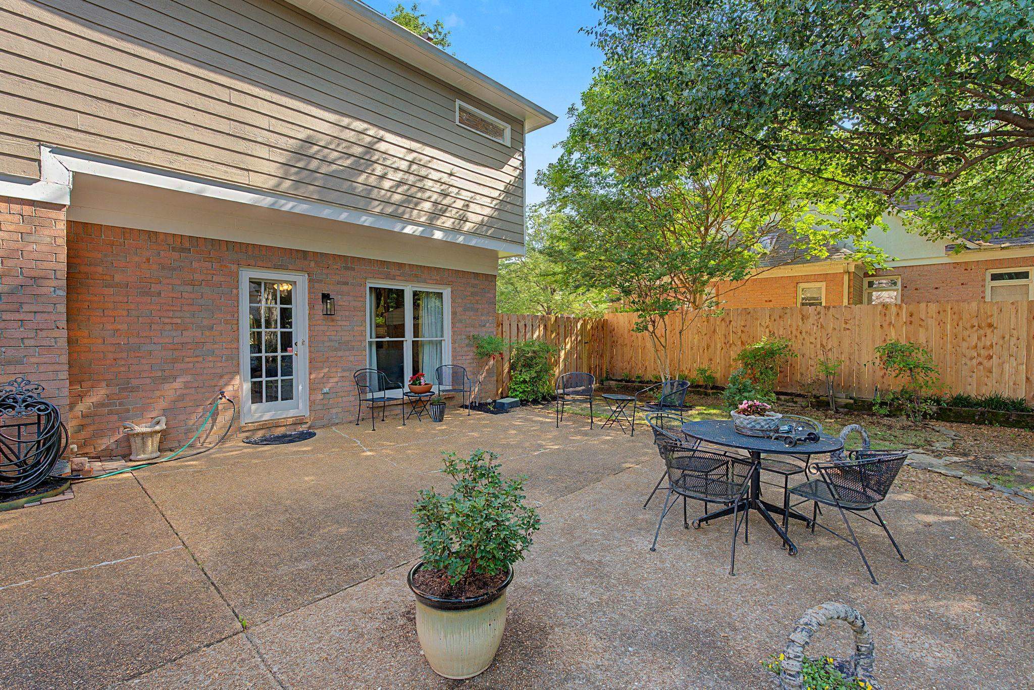 337 Revell Cove Collierville, TN 38017 - Photo 30 of 40 a backyard of a house with outdoor seating
