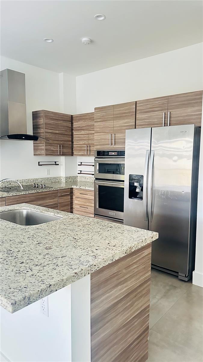3653 Southwest 25th Street, Unit 3653 Miami, FL 33133 - Photo 14 of 18 a kitchen with a refrigerator and a sink