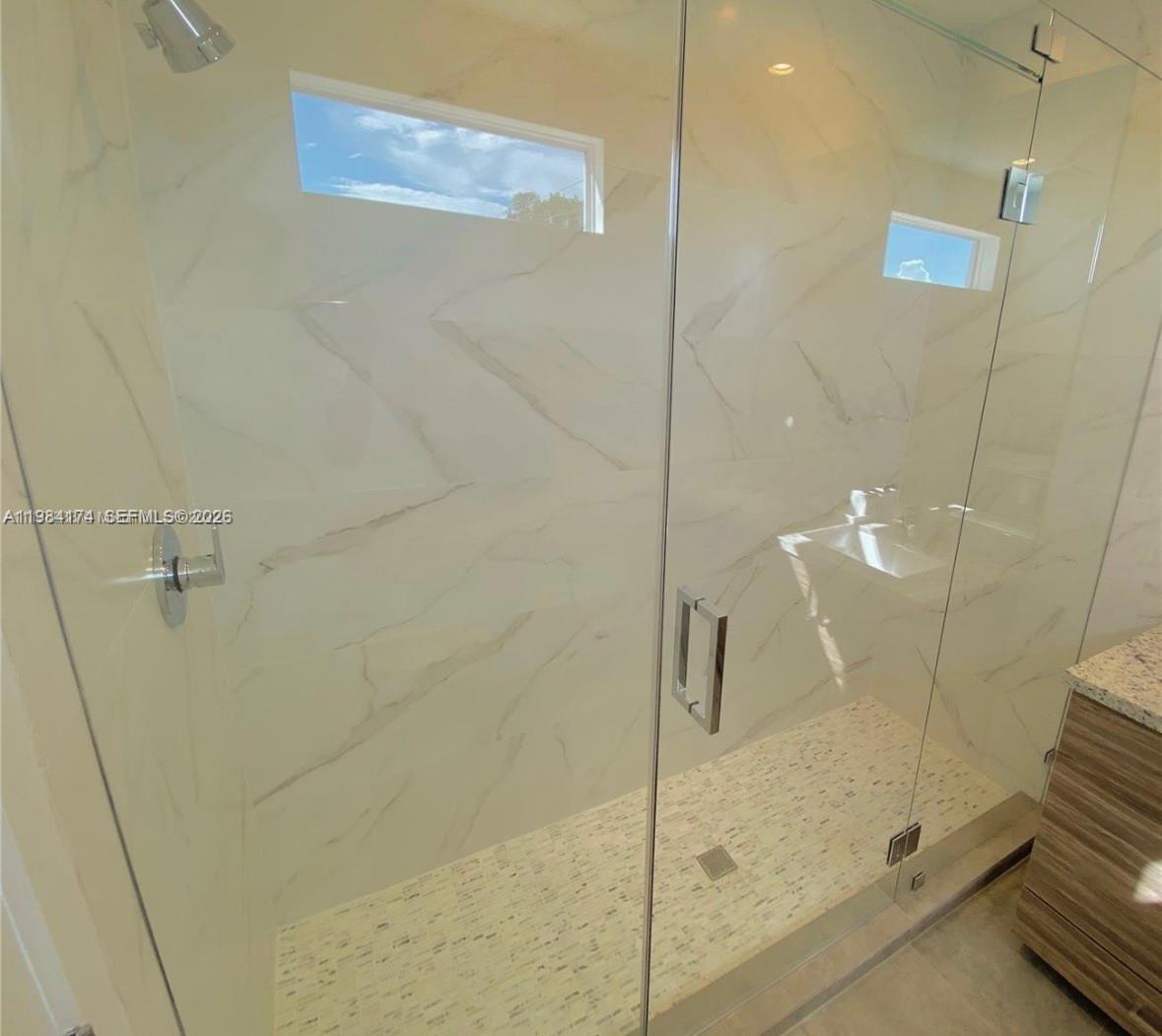 3653 Southwest 25th Street, Unit 3653 Miami, FL 33133 - Photo 4 of 18 a bathroom with a shower