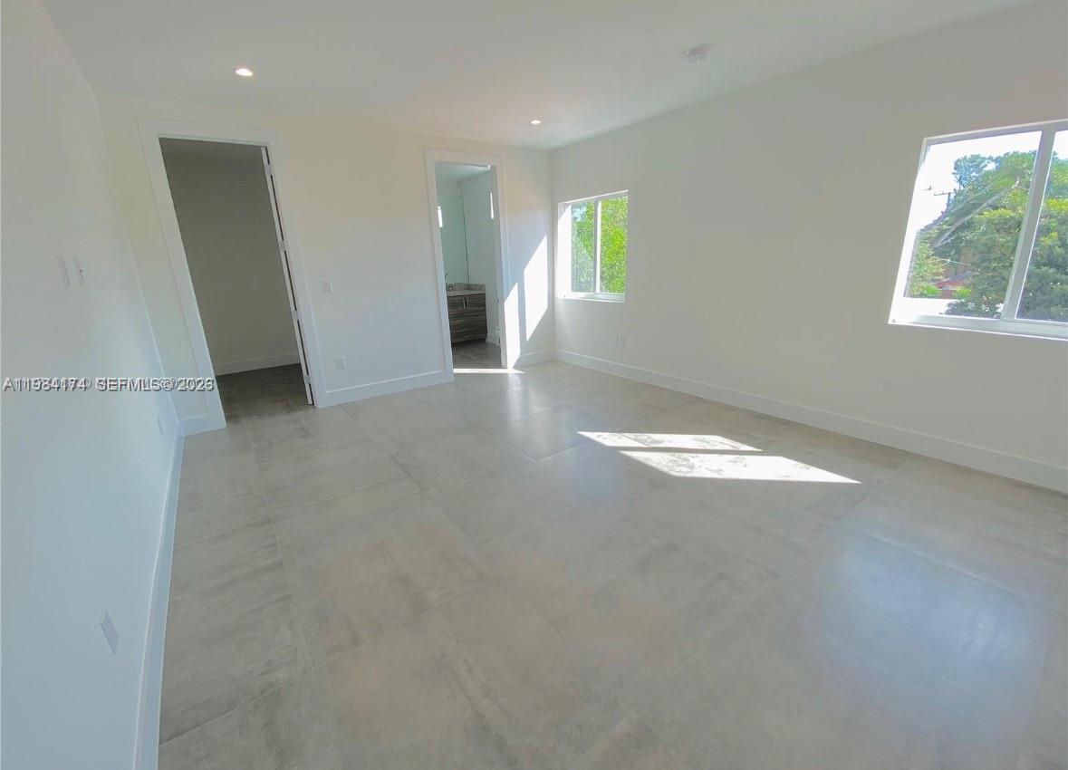 3653 Southwest 25th Street, Unit 3653 Miami, FL 33133 - Photo 6 of 18 an empty room with windows and closet