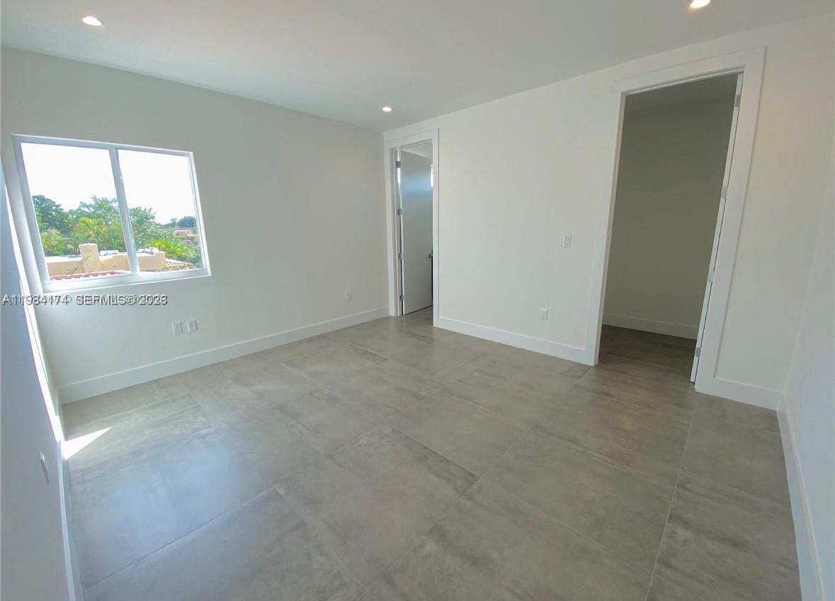 3653 Southwest 25th Street, Unit 3653 Miami, FL 33133 - Photo 8 of 18 an empty room with a window
