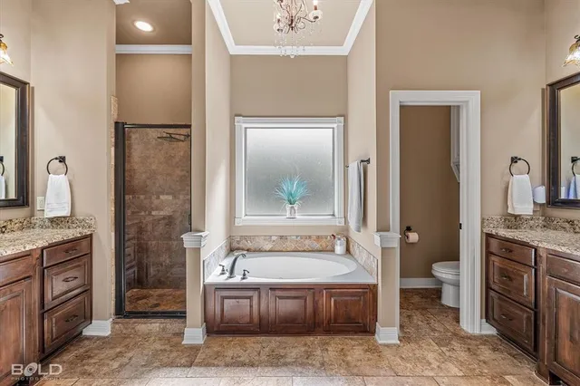 a spacious bathroom with a granite countertop tub sink and mirror