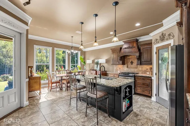 a view of a dining room with furniture window and outside view