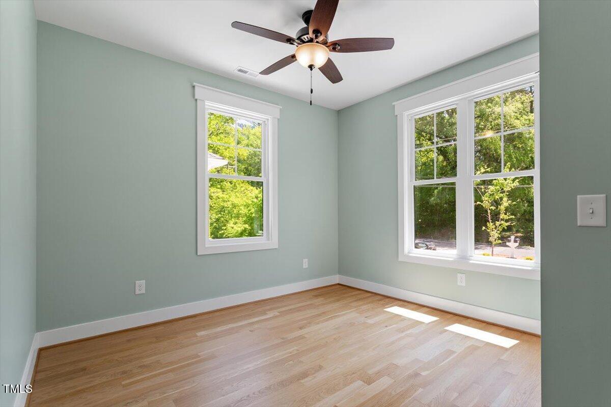 3934 Old Chapel Hill Road Durham, NC 27707 - Photo 33 of 47 a view of an empty room with wooden floor and a window