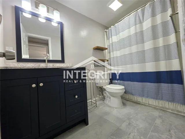 a close view of a utility room with dryer and washer