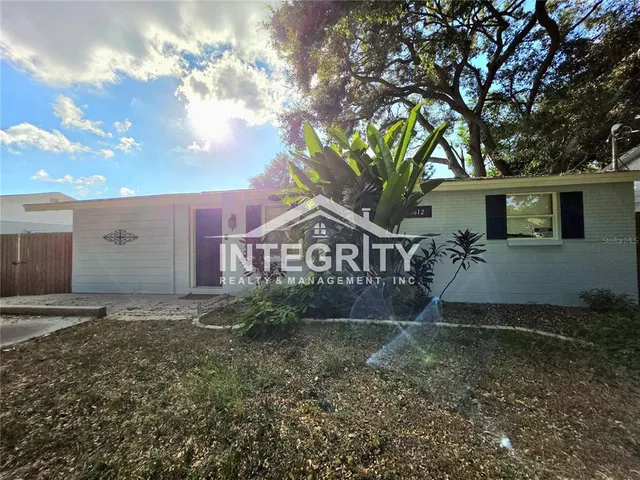 a view of a room with wooden floor and staircase