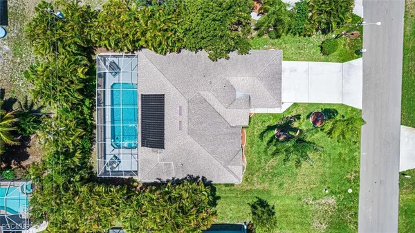 front view of a house with potted plants