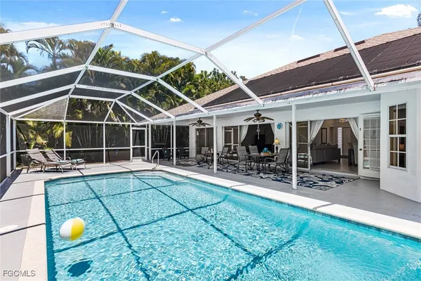 a view of a patio with table and chairs