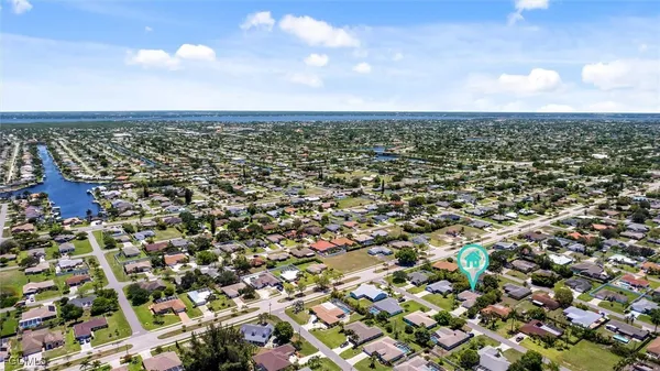 an aerial view of residential building and trees