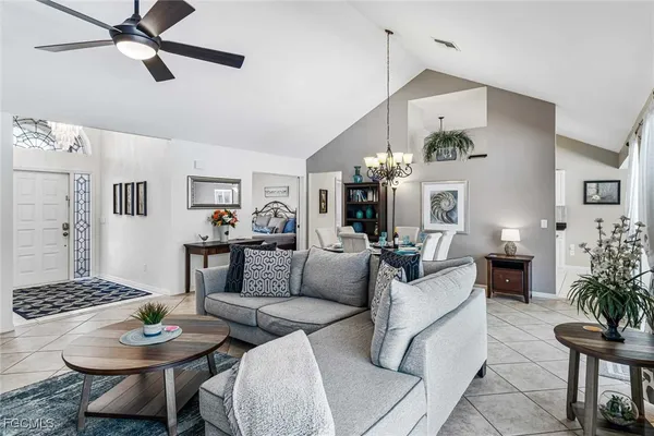 a living room with furniture and a table
