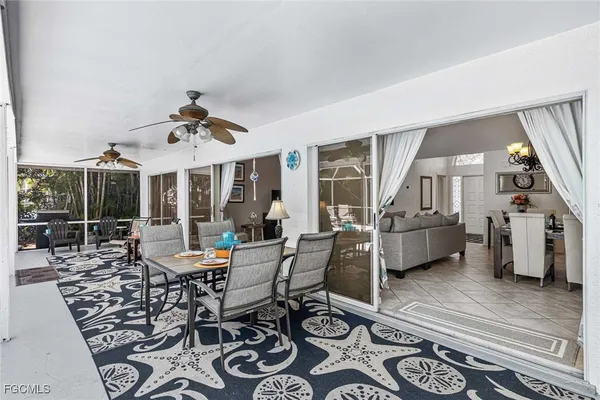 a view of a dining room and hall with furniture